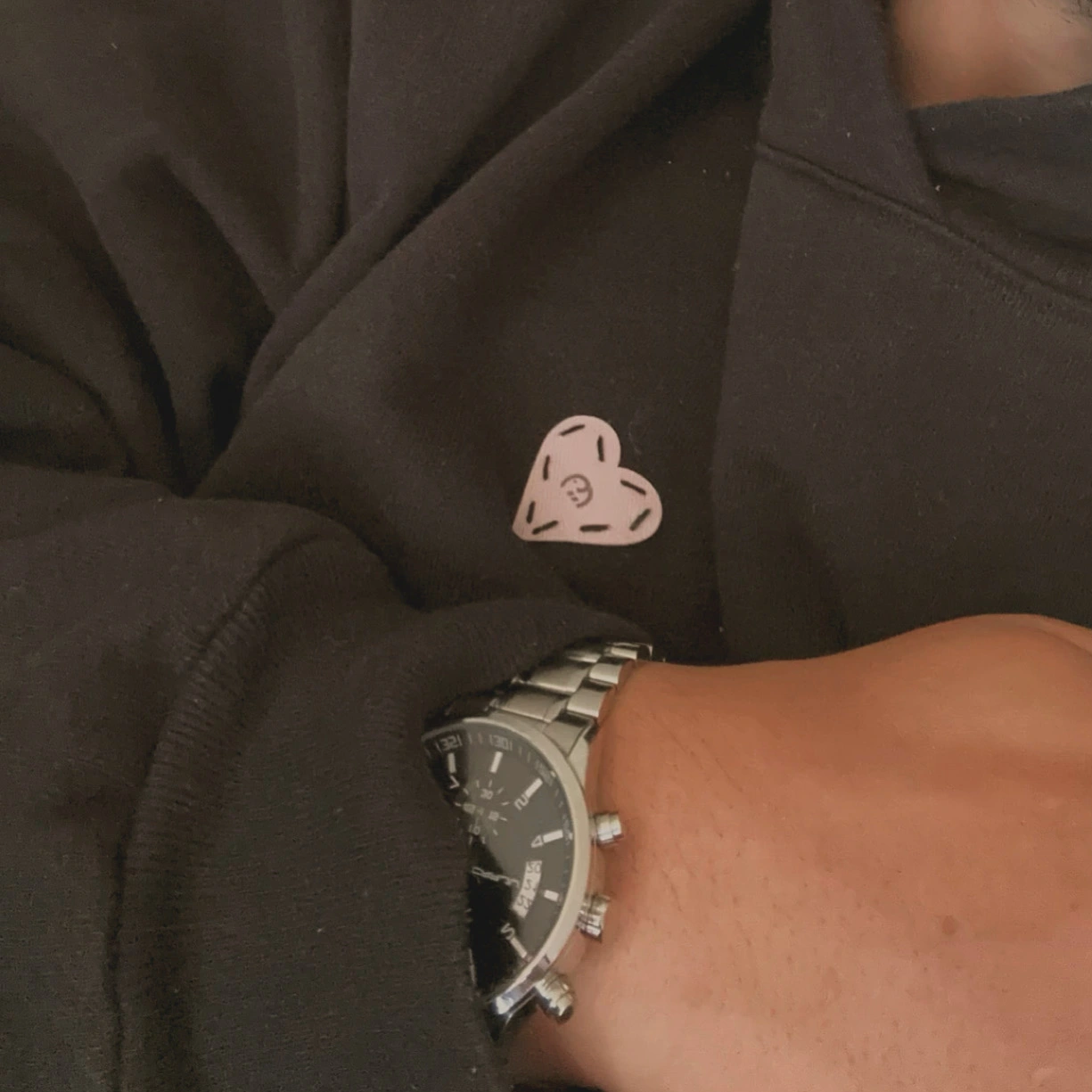 close-up of an eleif hoodie cuff paired with a watch.